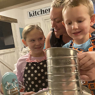 Karissa and family in the kitchen